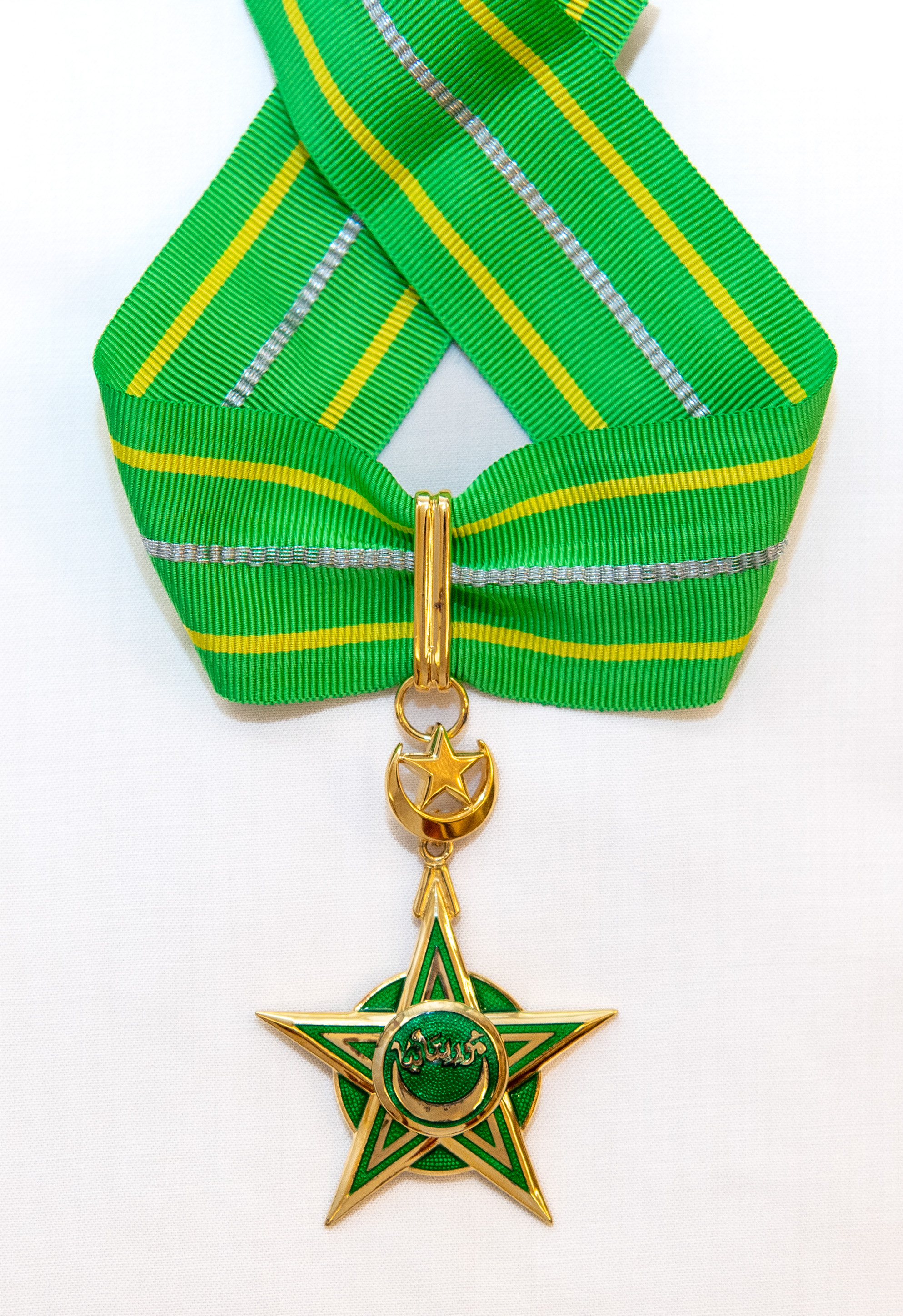 His Excellency the President of the Islamic Republic of Mauritania, Mohamed Ould Cheikh Ghazouani, awards His Excellency Sheikh Dr. Mohammed Al-Issa the medal of Commander of the National Order of Merit