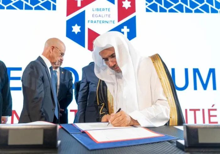 HE Dr. Mohammad Alissa stood with prominent Muslim, Jewish and Christian leaders to sign a historic MOU